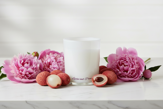 Candle in a glass jar with 'Lychee and Peony' text on a blue background