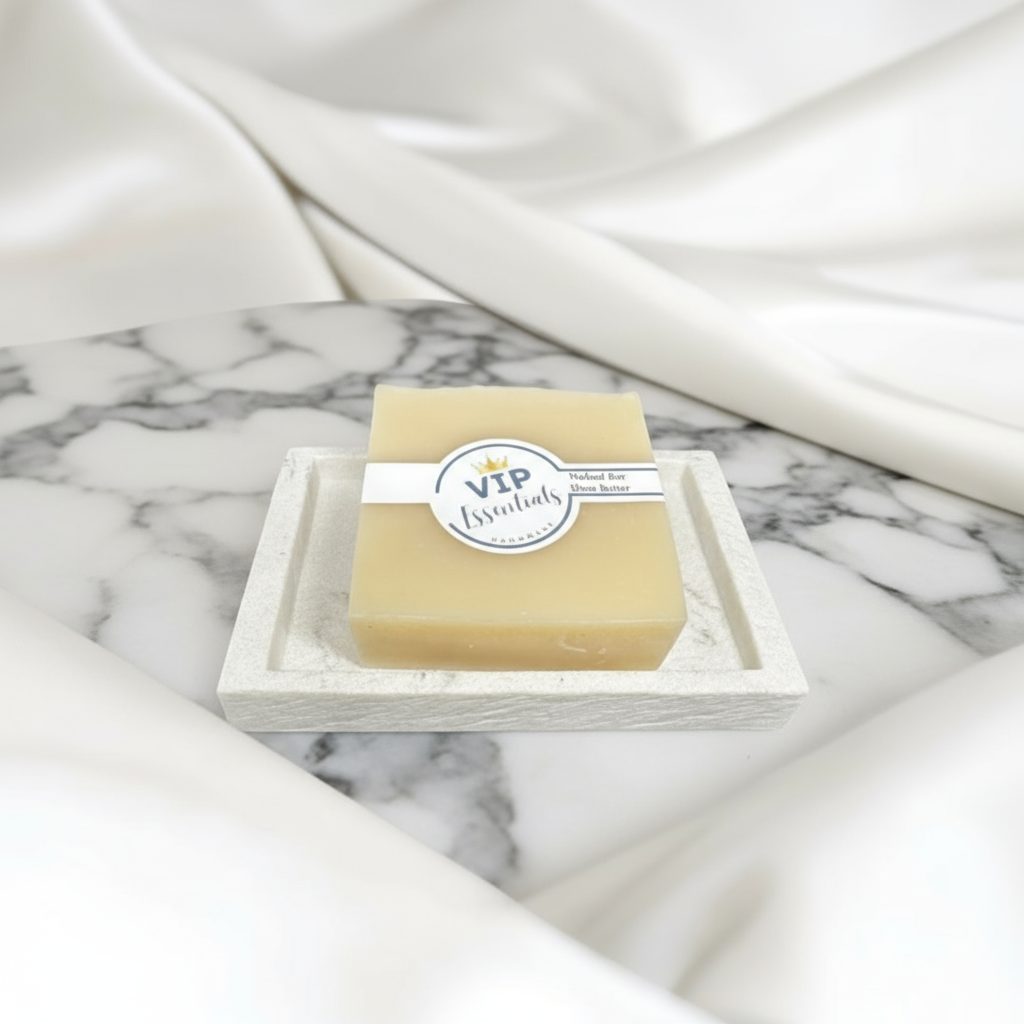 Bar of soap with a 'VIP Essentials' label on a marble surface