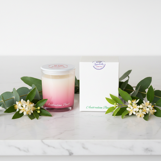 Candle with gradient design and matching box on a white background