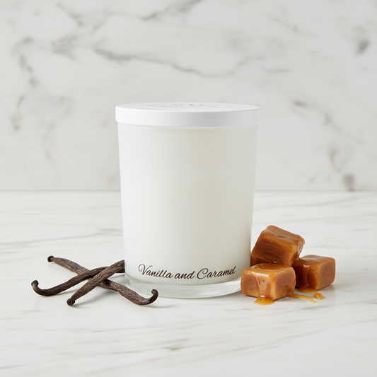 Frosted glass candle with 'Vanilla and Caramel' text on a blue background