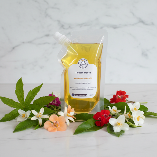 A 300ml refill pouch of VIP Herbs 'Tibetan Trance' Red Diffuser Refill, filled with yellow liquid, shown against a solid blue background.
