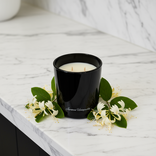 Black candle holder with a white candle inside on a white background
